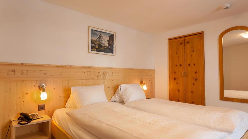 Postel nebo postele na pokoji v ubytování Hotel Capricorn