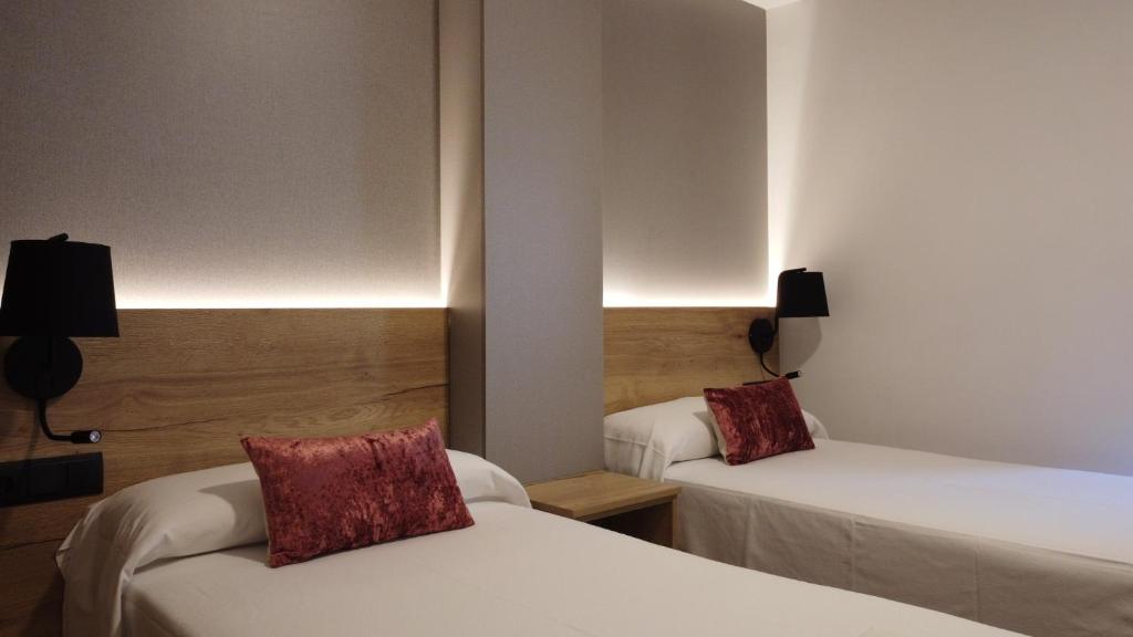 Postel nebo postele na pokoji v ubytování Hotel La Bonaigua