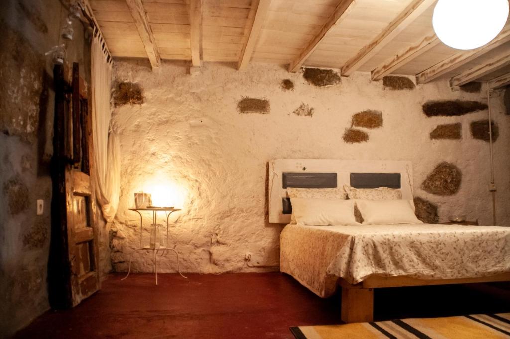 Postel nebo postele na pokoji v ubytování Quintinha Viçosa