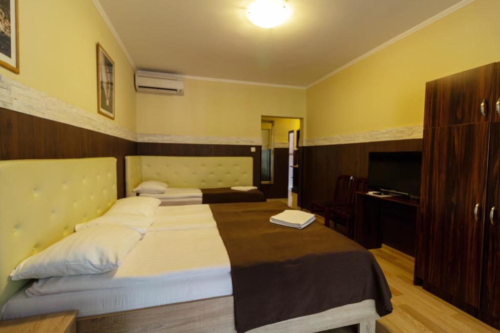 Posteľ alebo postele v izbe v ubytovaní Bella Villa