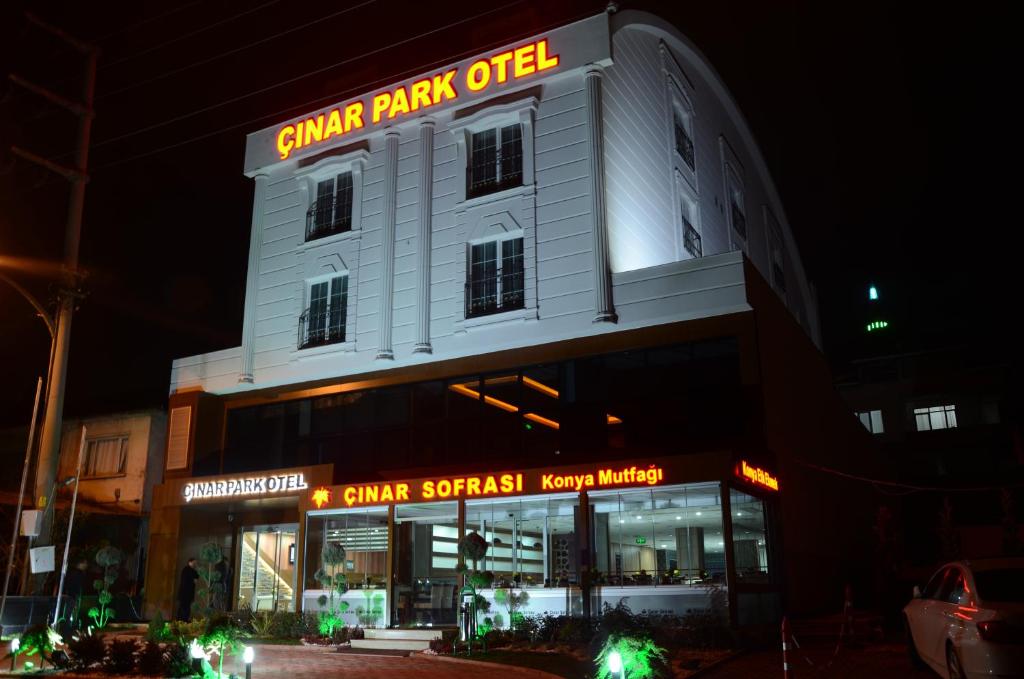 a white building with a sign on top of it at Çınarpark Hotel in Korfez