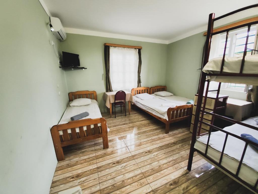 Postel nebo postele na pokoji v ubytování Ureki House