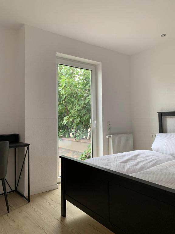 Postel nebo postele na pokoji v ubytování HGH - Hotel Garni Helbig