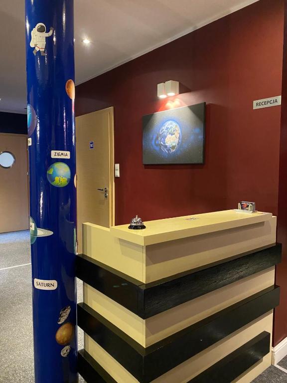 Televízia a/alebo spoločenská miestnosť v ubytovaní Hostel Galaxy