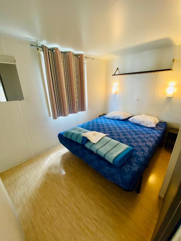 Postel nebo postele na pokoji v ubytování Mobilhomes de Pierrot