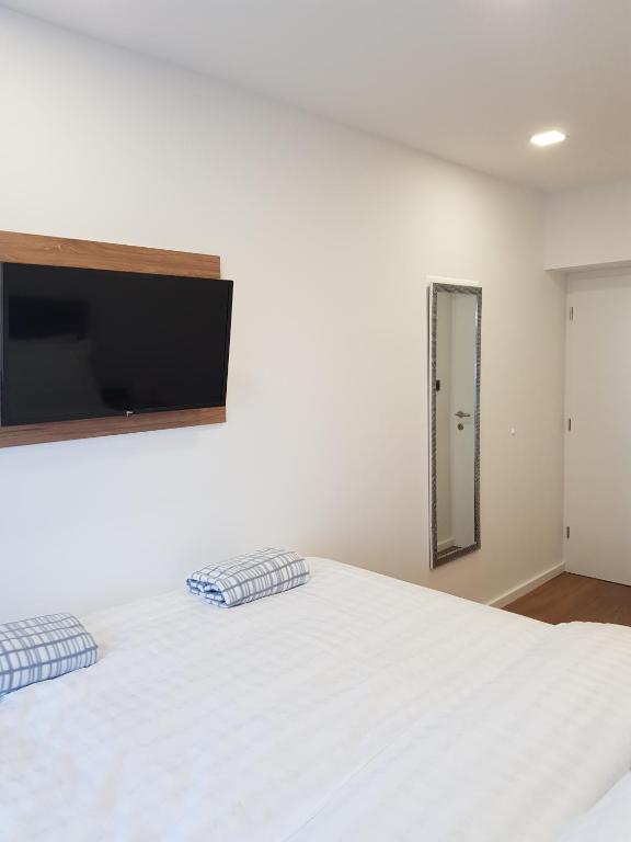 Łóżko lub łóżka w pokoju w obiekcie MarSim Lux apartman Zagreb