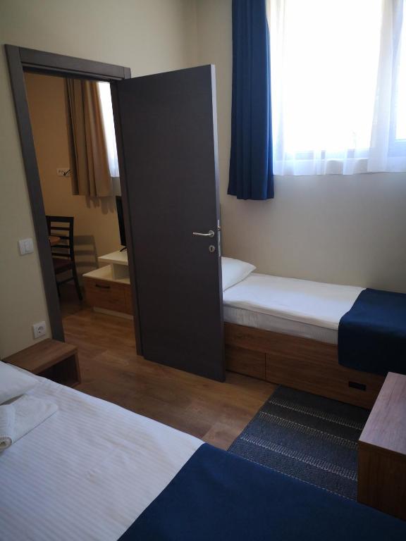 Postel nebo postele na pokoji v ubytování Apartments&Camping ZIP