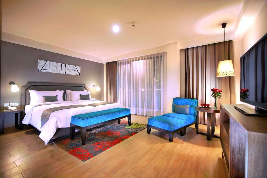 Postel nebo postele na pokoji v ubytování Harper Kuta Hotel by ASTON