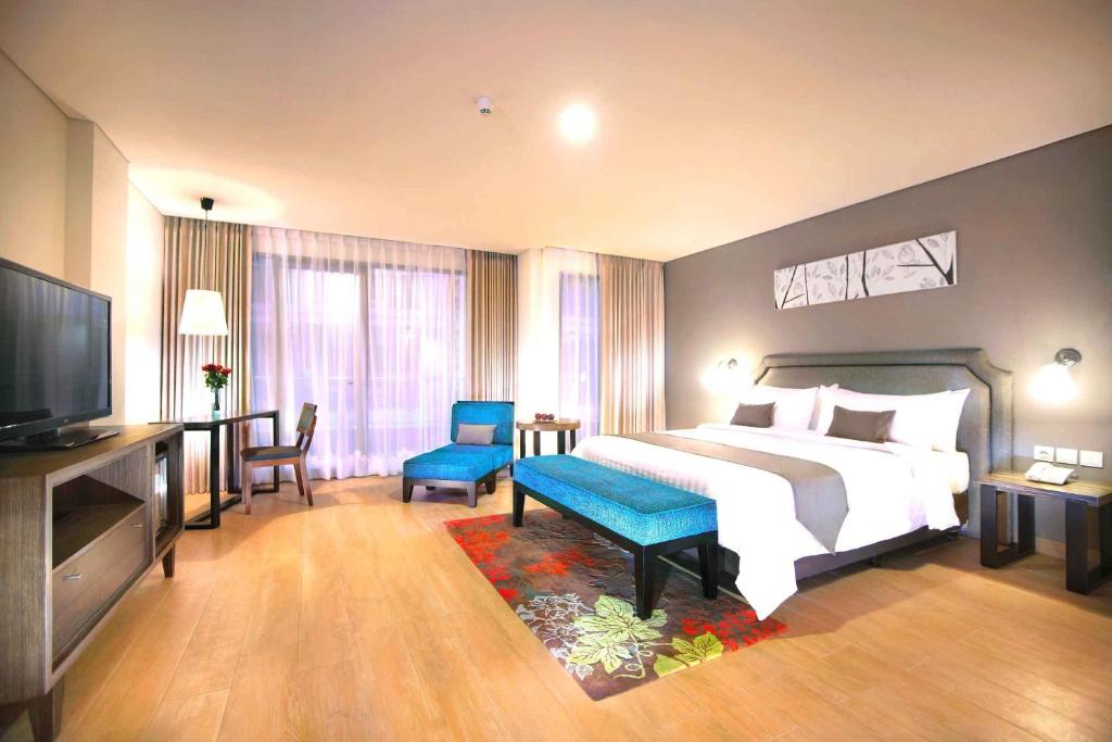 Postel nebo postele na pokoji v ubytování Harper Kuta Hotel by ASTON