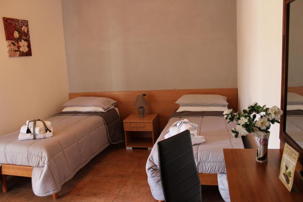 Postel nebo postele na pokoji v ubytování B&B La Vigna