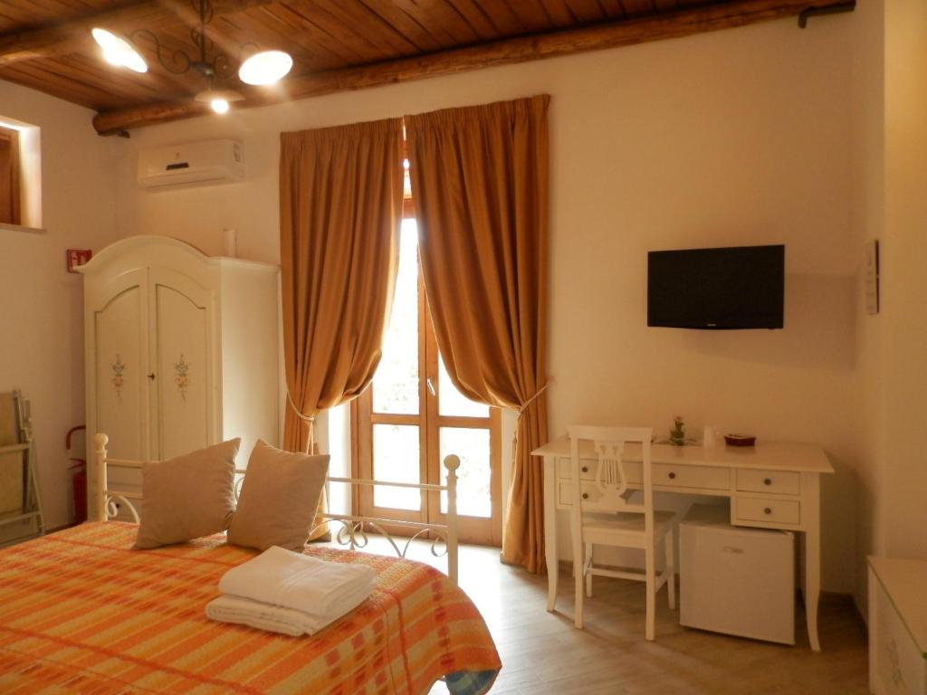 Postel nebo postele na pokoji v ubytování Agriturismo Orrido di Pino