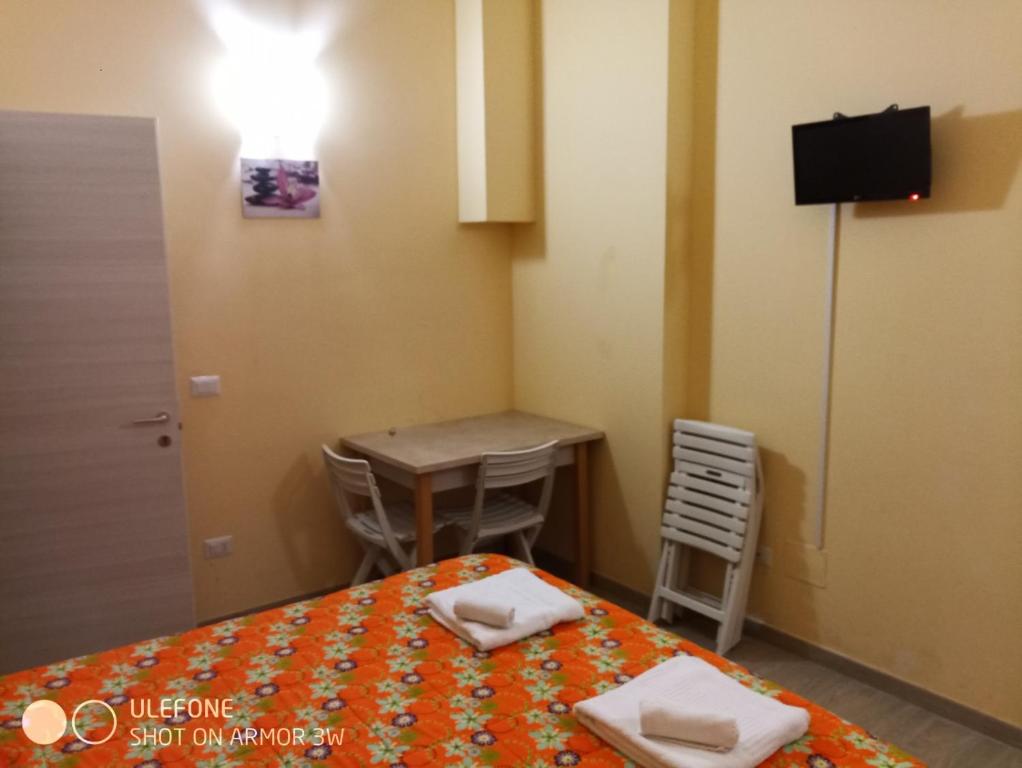 Llit o llits en una habitació de Bed & Breakfast Le Torri