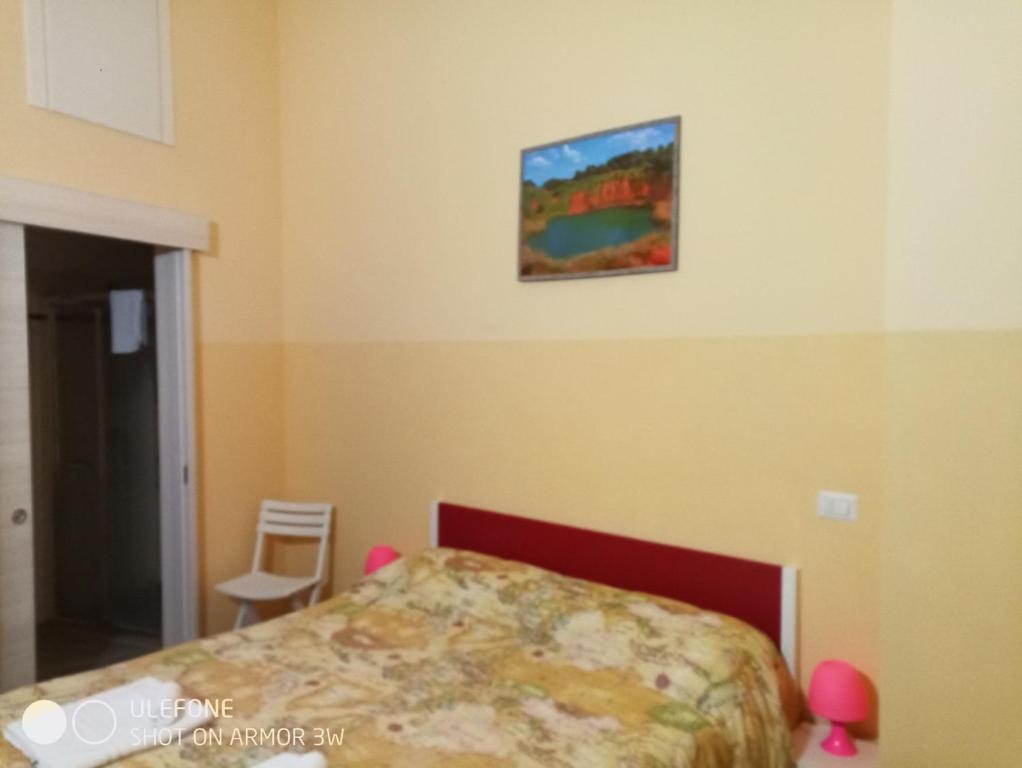 Llit o llits en una habitació de Bed & Breakfast Le Torri