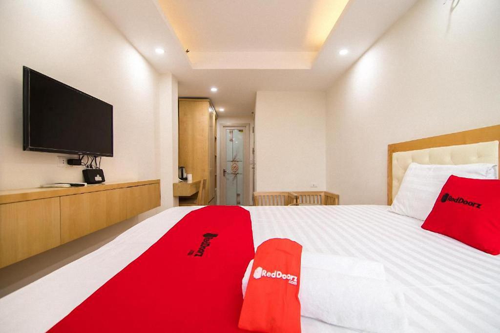 Postel nebo postele na pokoji v ubytování Galaxy Hanoi Hotel & Apartment - 12 ngõ 80 Trần Duy Hưng