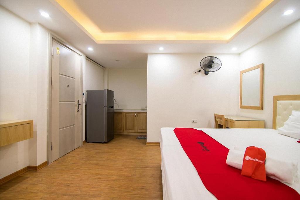 Postel nebo postele na pokoji v ubytování Galaxy Hanoi Hotel & Apartment - 12 ngõ 80 Trần Duy Hưng