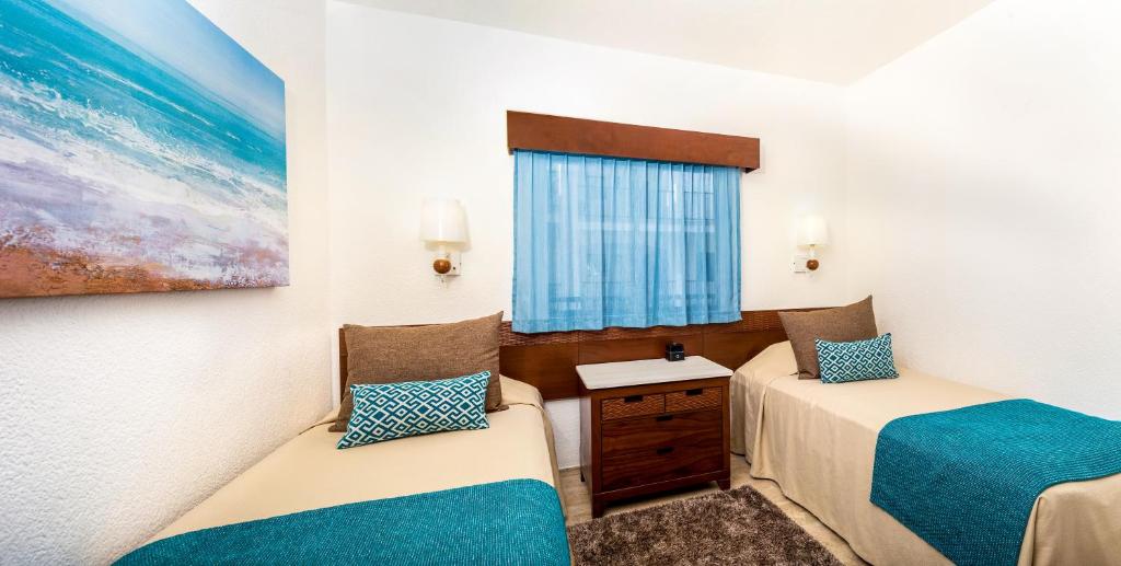 Postel nebo postele na pokoji v ubytování The Royal Cancun All Villas Resort