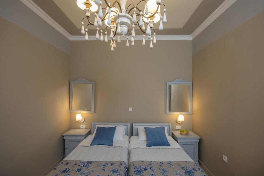 Postel nebo postele na pokoji v ubytování Pelagos Apartments