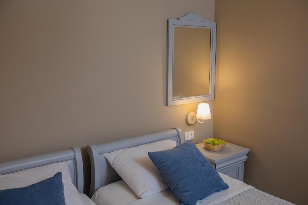 Postel nebo postele na pokoji v ubytování Pelagos Apartments
