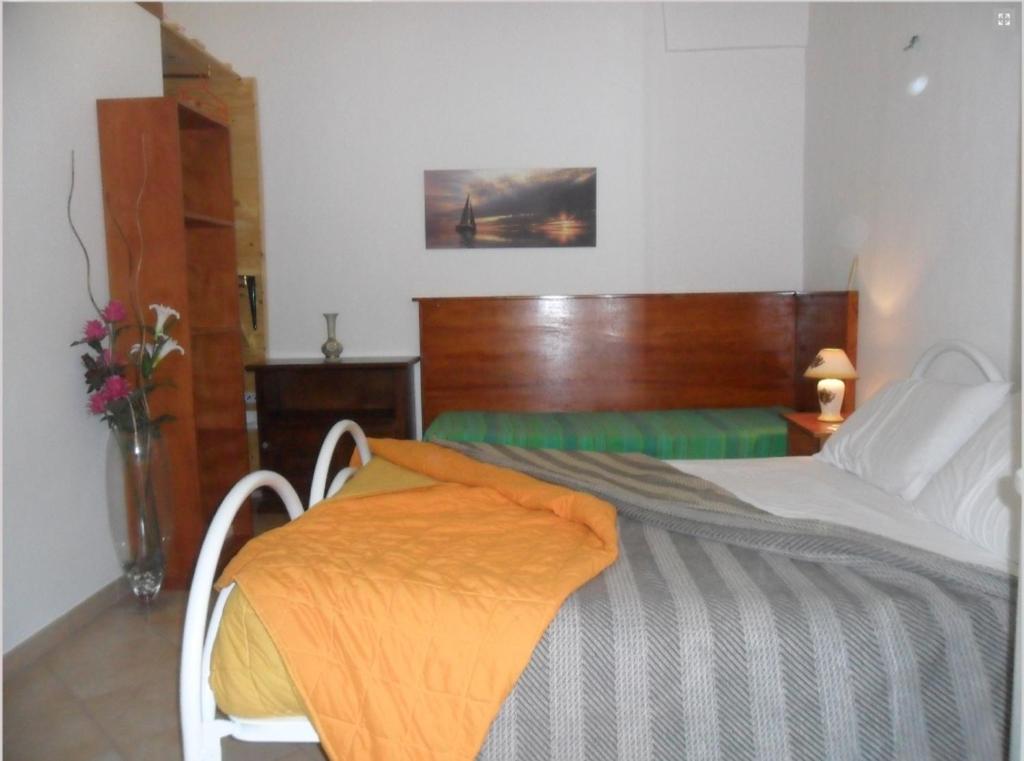 A bed or beds in a room at La Stanza Alternativa