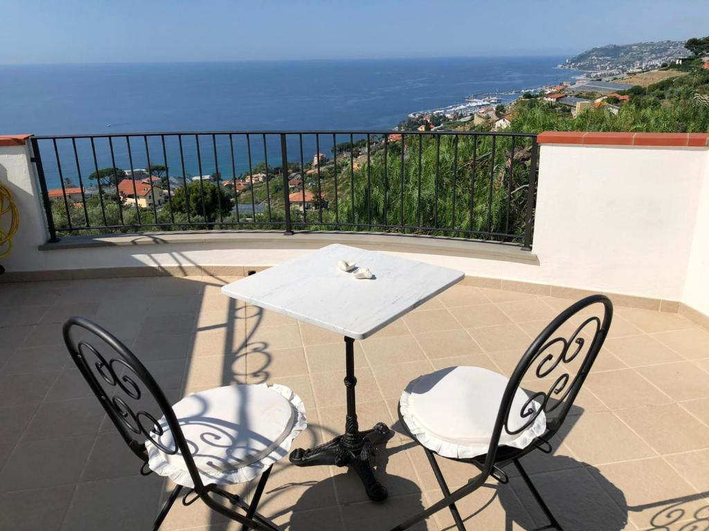 a table with chairs and a table cloth at La Casa Di Sissi B&B in Sanremo