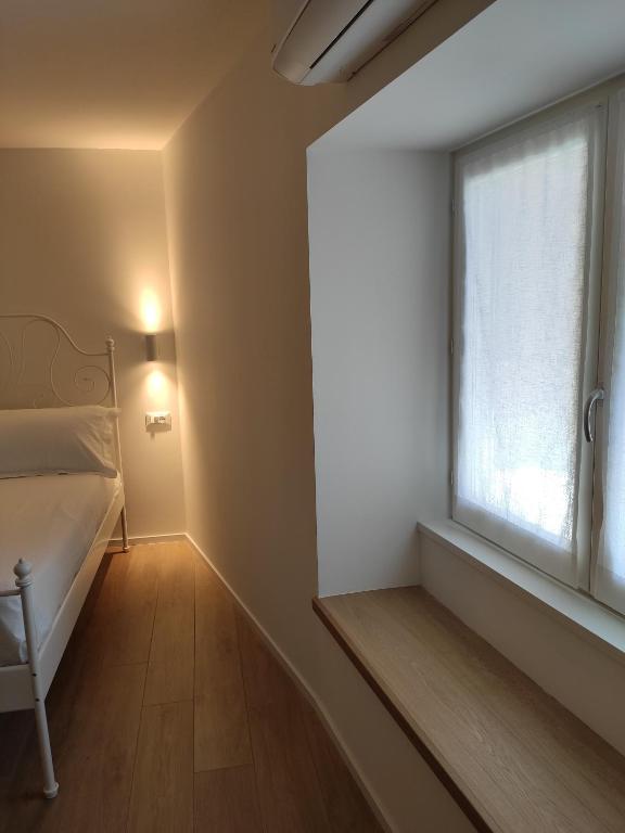 Postel nebo postele na pokoji v ubytování Borgo di Ponte Holiday Apartments & Rooms