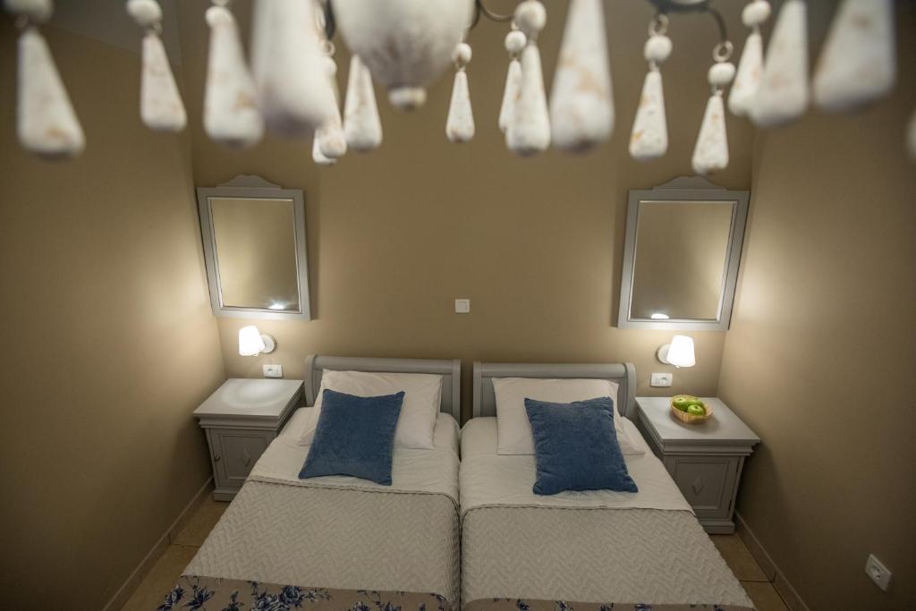 Postel nebo postele na pokoji v ubytování Pelagos Apartments