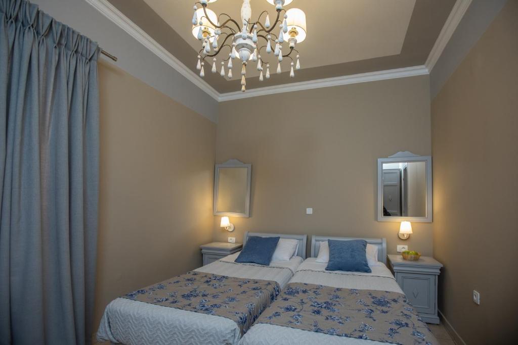 Postel nebo postele na pokoji v ubytování Pelagos Apartments