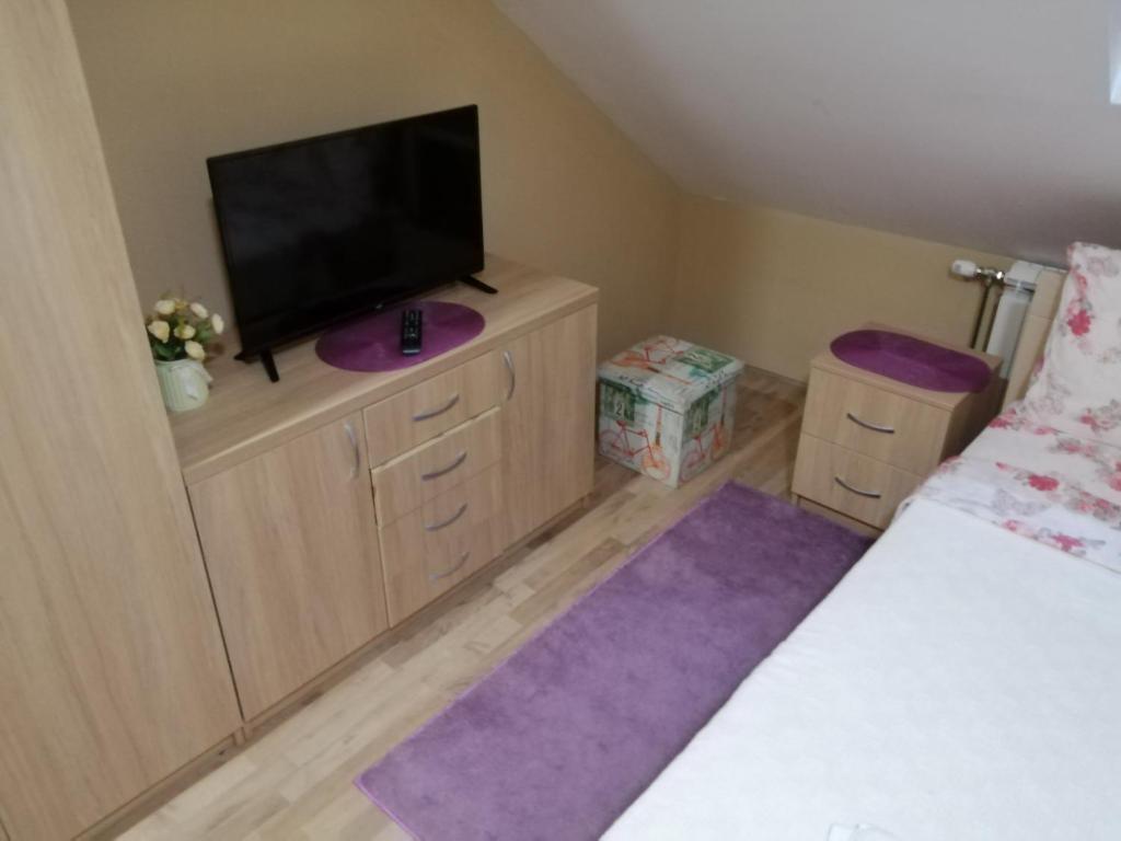 Postel nebo postele na pokoji v ubytování Apartmani Milošević