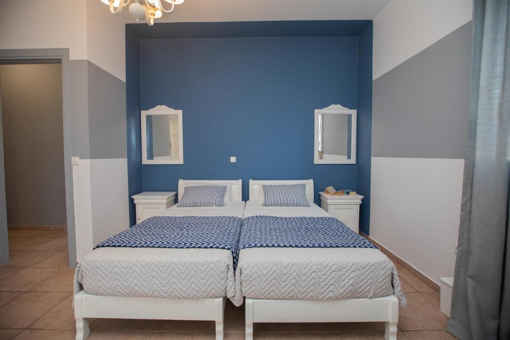 Postel nebo postele na pokoji v ubytování Pelagos Apartments