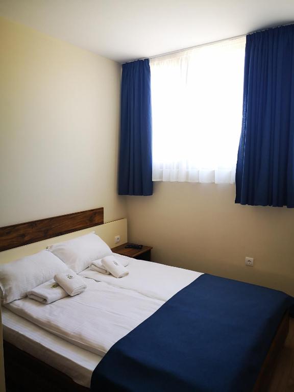 Postel nebo postele na pokoji v ubytování Apartments&Camping ZIP
