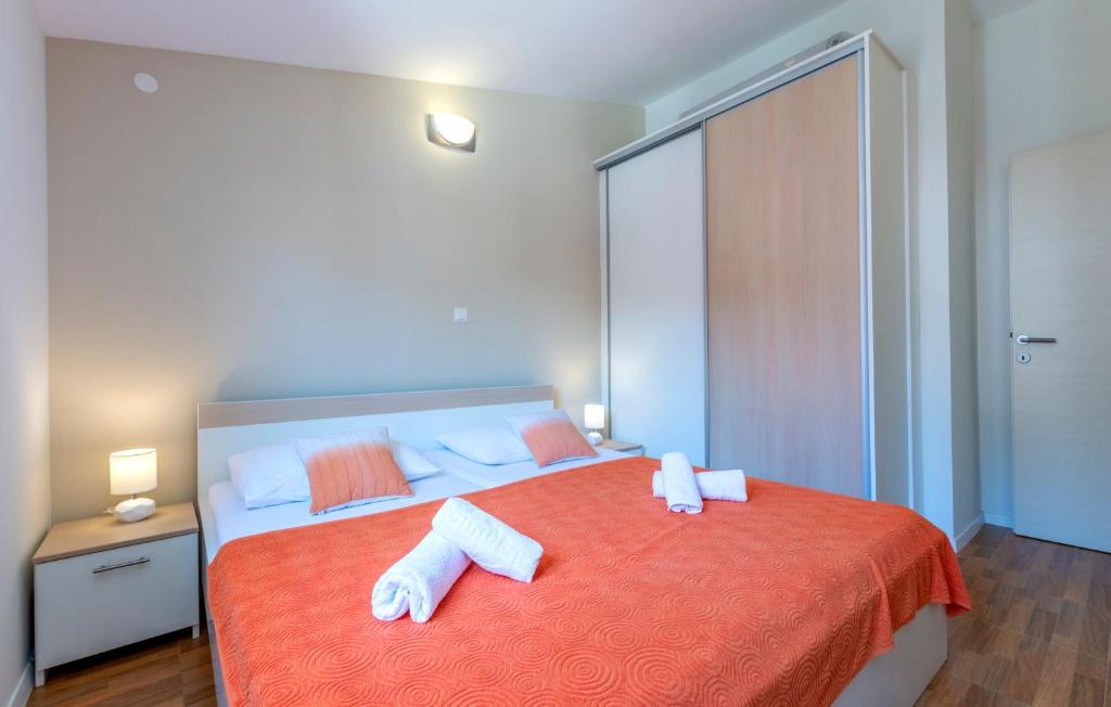 Postel nebo postele na pokoji v ubytování Apartments Listes