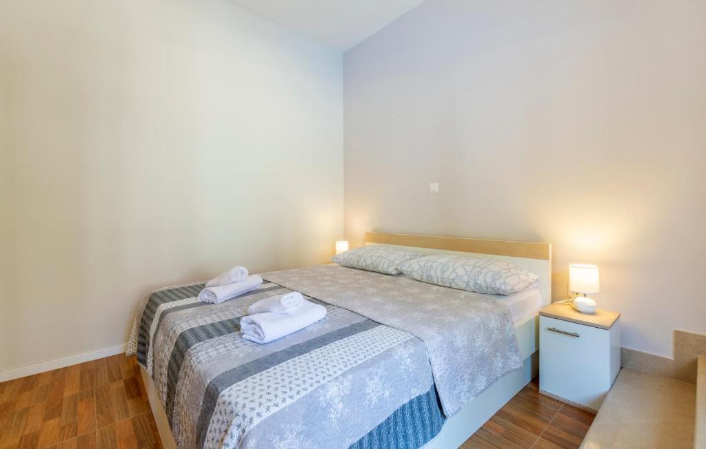 Postel nebo postele na pokoji v ubytování Apartments Listes