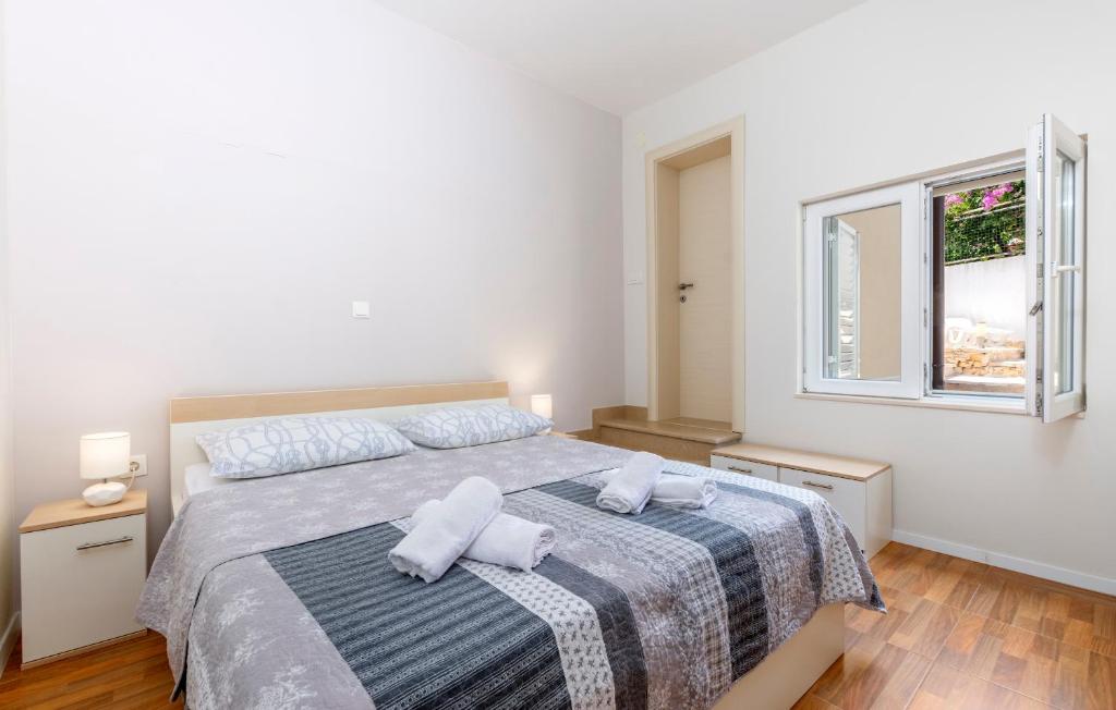 Postel nebo postele na pokoji v ubytování Apartments Listes