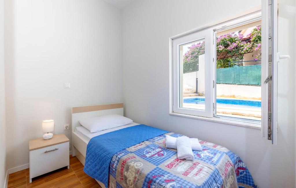 Postel nebo postele na pokoji v ubytování Apartments Listes