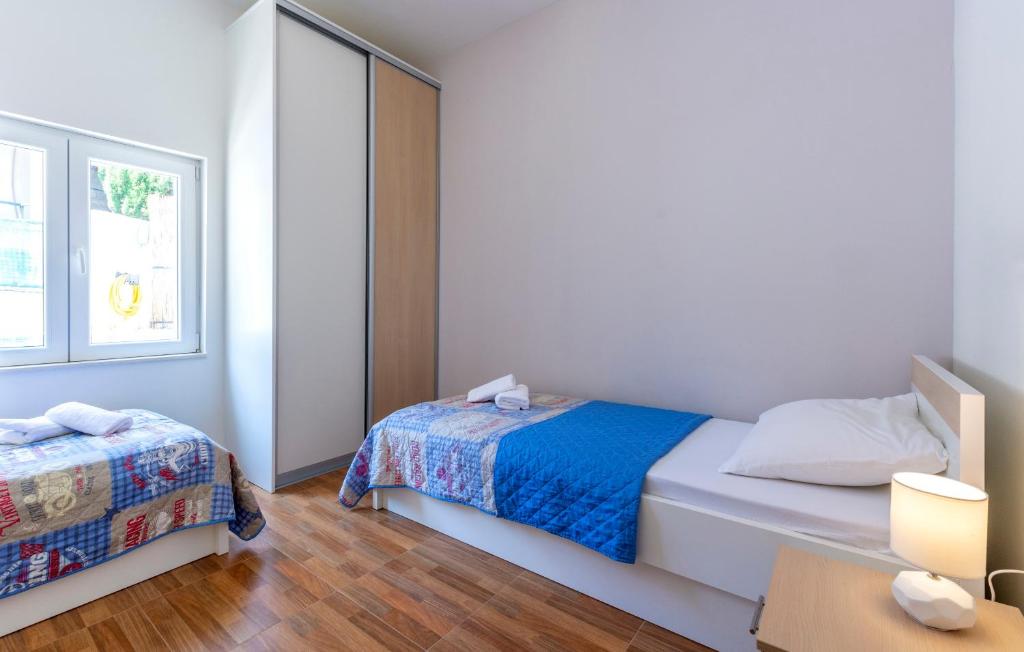 Postel nebo postele na pokoji v ubytování Apartments Listes