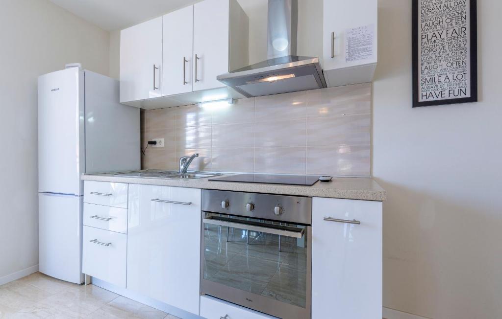 Kuchyň nebo kuchyňský kout v ubytování Apartments Listes