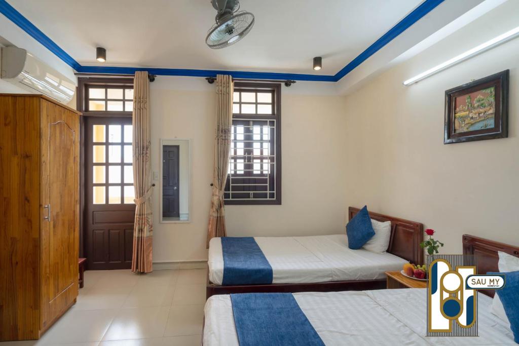 Postel nebo postele na pokoji v ubytování Sau My Homestay