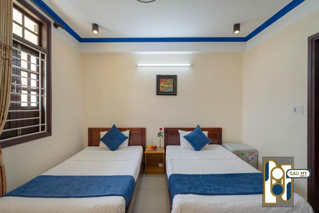 Postel nebo postele na pokoji v ubytování Sau My Homestay