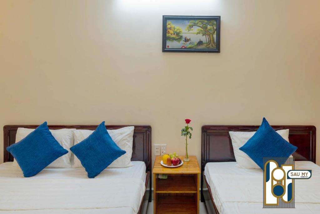 Postel nebo postele na pokoji v ubytování Sau My Homestay