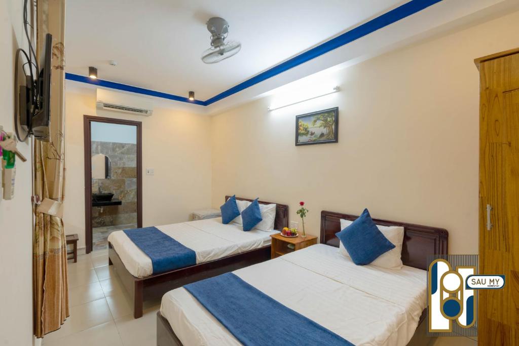 Postel nebo postele na pokoji v ubytování Sau My Homestay