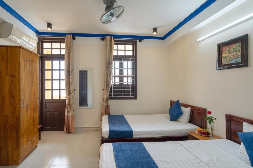 Postel nebo postele na pokoji v ubytování Sau My Homestay