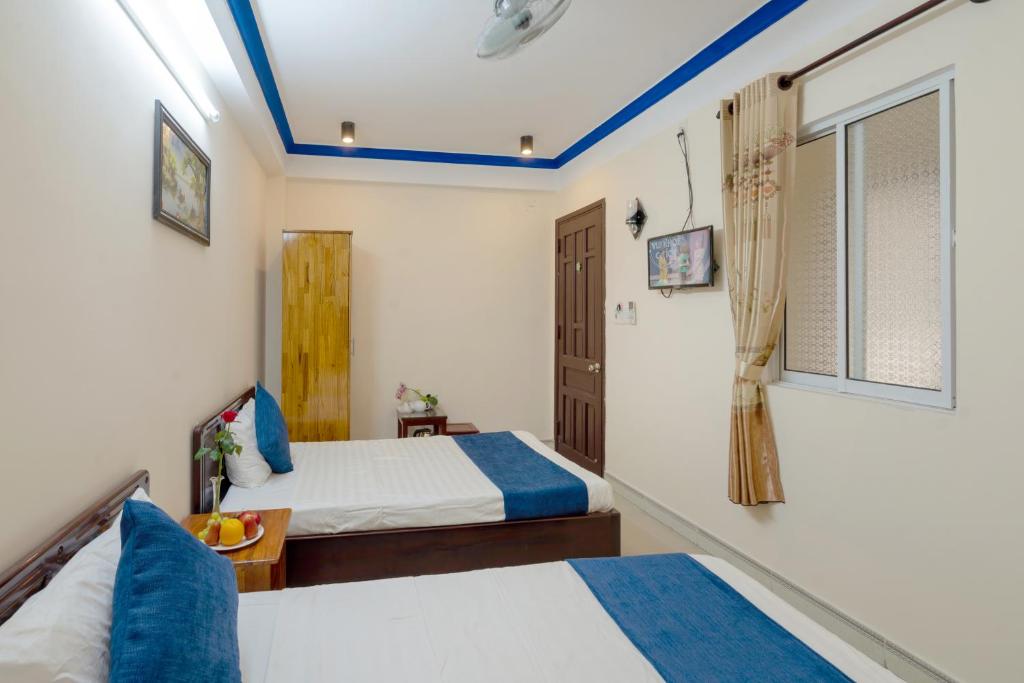 Postel nebo postele na pokoji v ubytování Sau My Homestay
