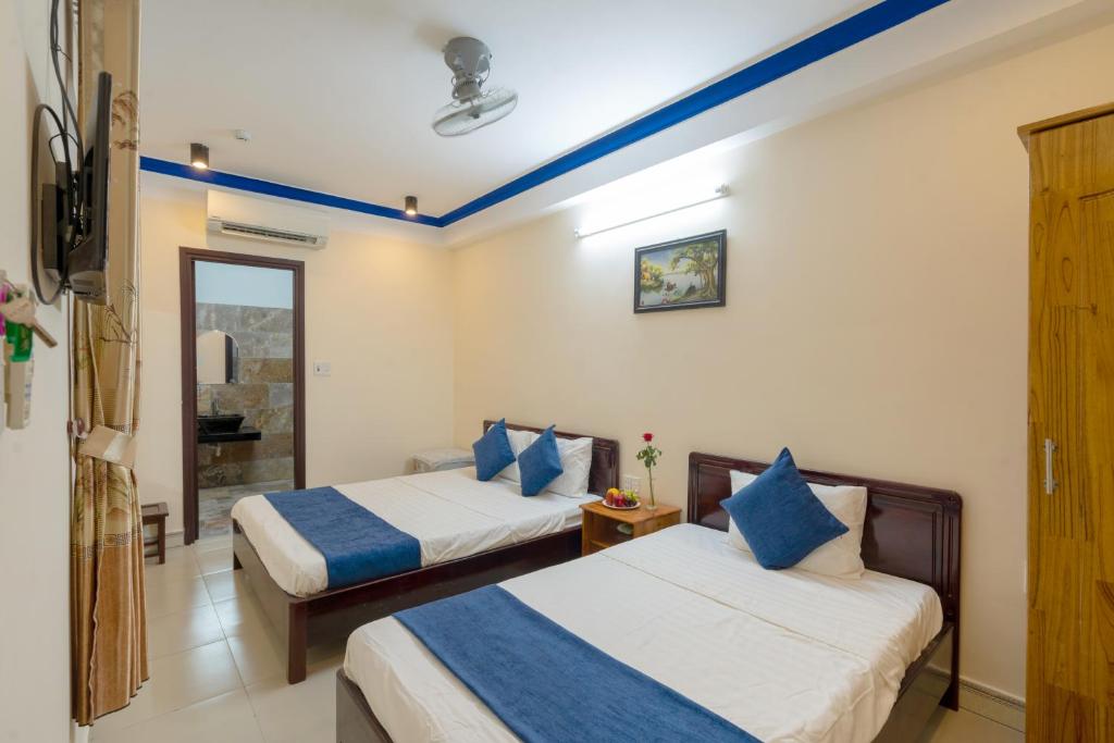Postel nebo postele na pokoji v ubytování Sau My Homestay