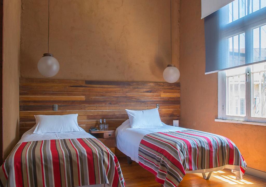 Postel nebo postele na pokoji v ubytování Fauna Hotel