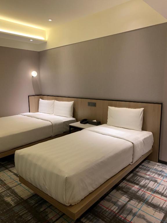 Postel nebo postele na pokoji v ubytování Hotel Midtown Richardson