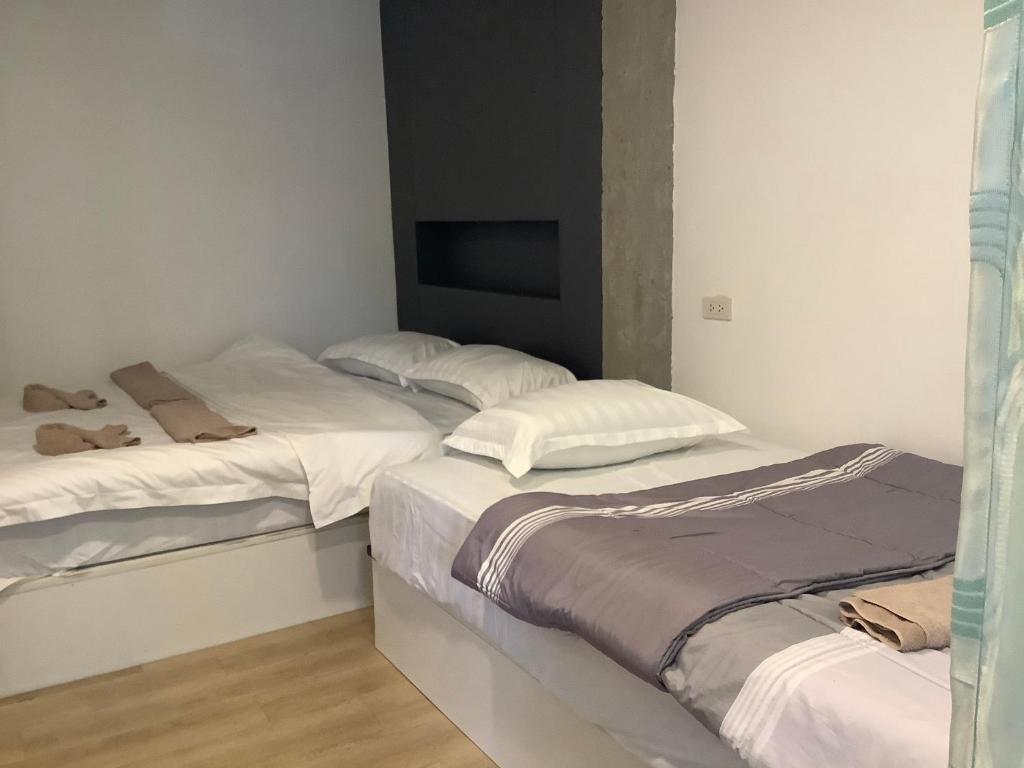 Postel nebo postele na pokoji v ubytování Room@Nimman