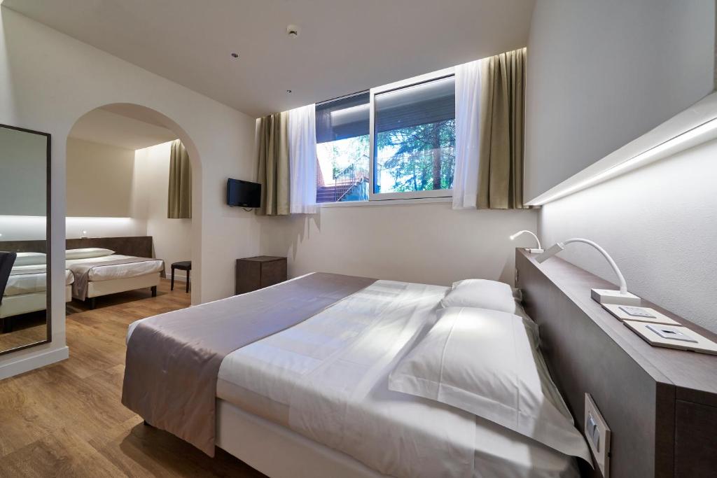 Postel nebo postele na pokoji v ubytování Park Hotel Chianti