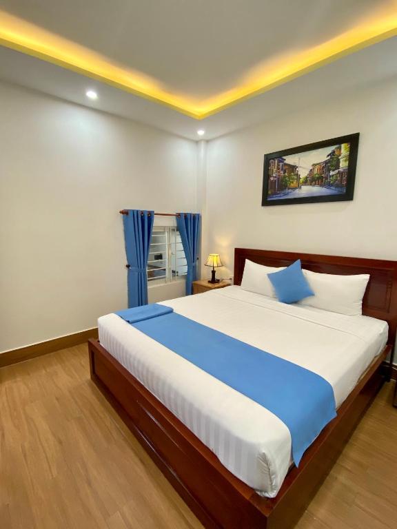 Postel nebo postele na pokoji v ubytování Hoi An Impression Homestay
