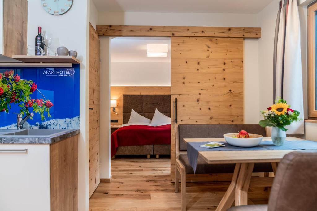 Postel nebo postele na pokoji v ubytování Aparthotel Ramsau