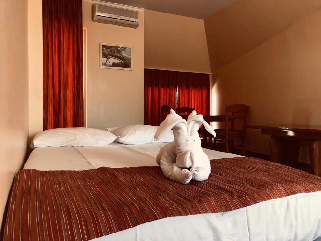 Postel nebo postele na pokoji v ubytování Family Hotel Deja Vu